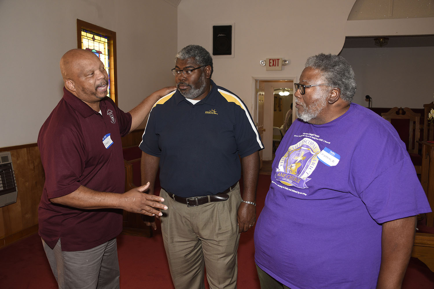 Marc Thomas (center), director of field operations for Fort Valley State University’s Cooperative Extension Program, listens to concerns voiced by Stan Smith (left) and C. W. Watkins (right) during the Managing Your Land for Profit Workshop in Sparta.