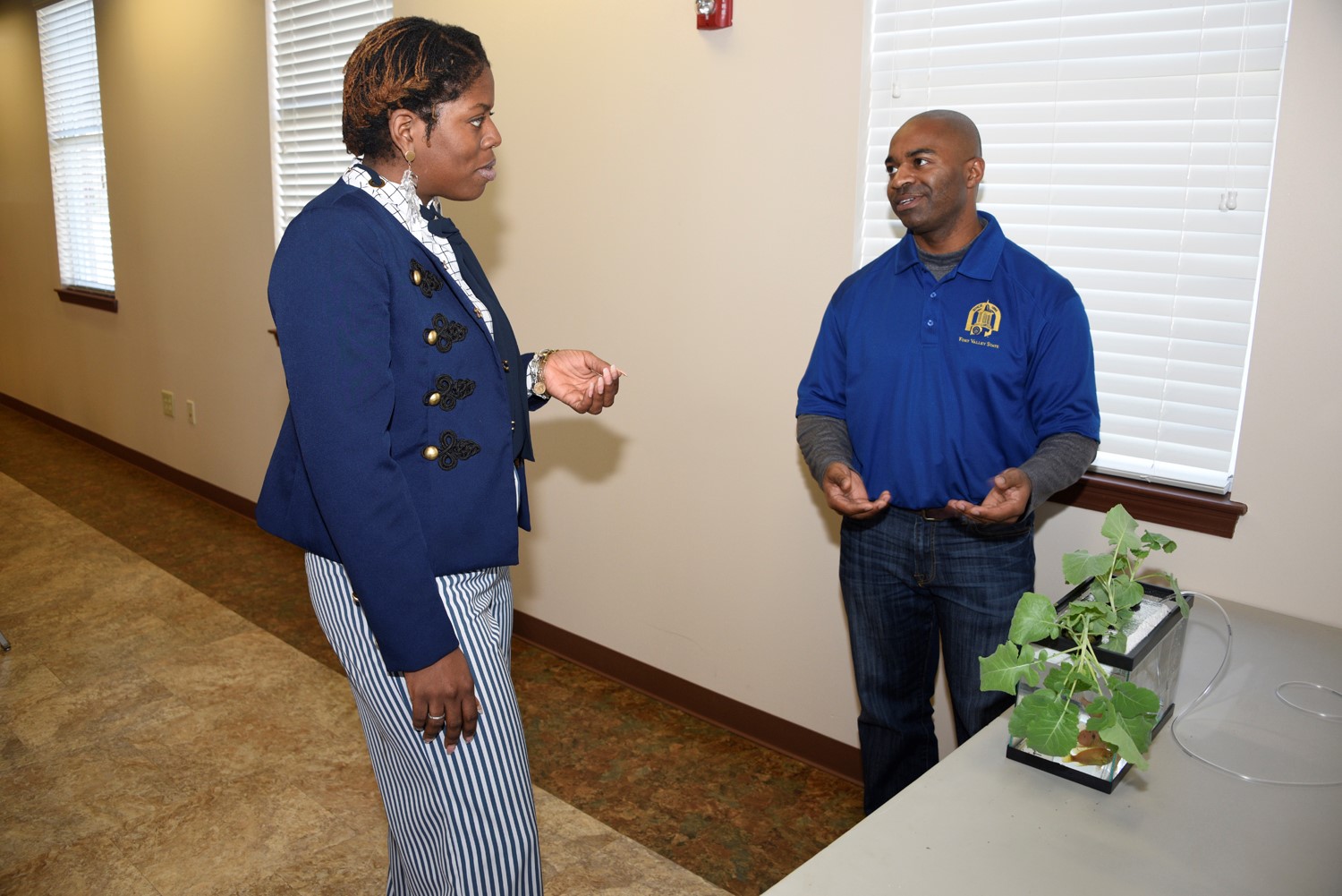 Donald Bacoat (right), Fort Valley State University’s aquaculture and production assistant, explains the basics of aquaculture to Shakeena Reeves (left), a junior agricultural economics major, during the Water Safety and Conservation Workshop at the Agricultural Technology Conference Center on Jan. 15.