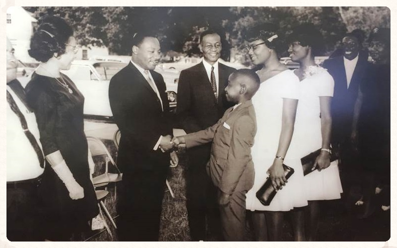 Dr. Martin Luther King, Jr. visits Fort Valley State College, 1966. Pictured standing next to President Troup (middle).