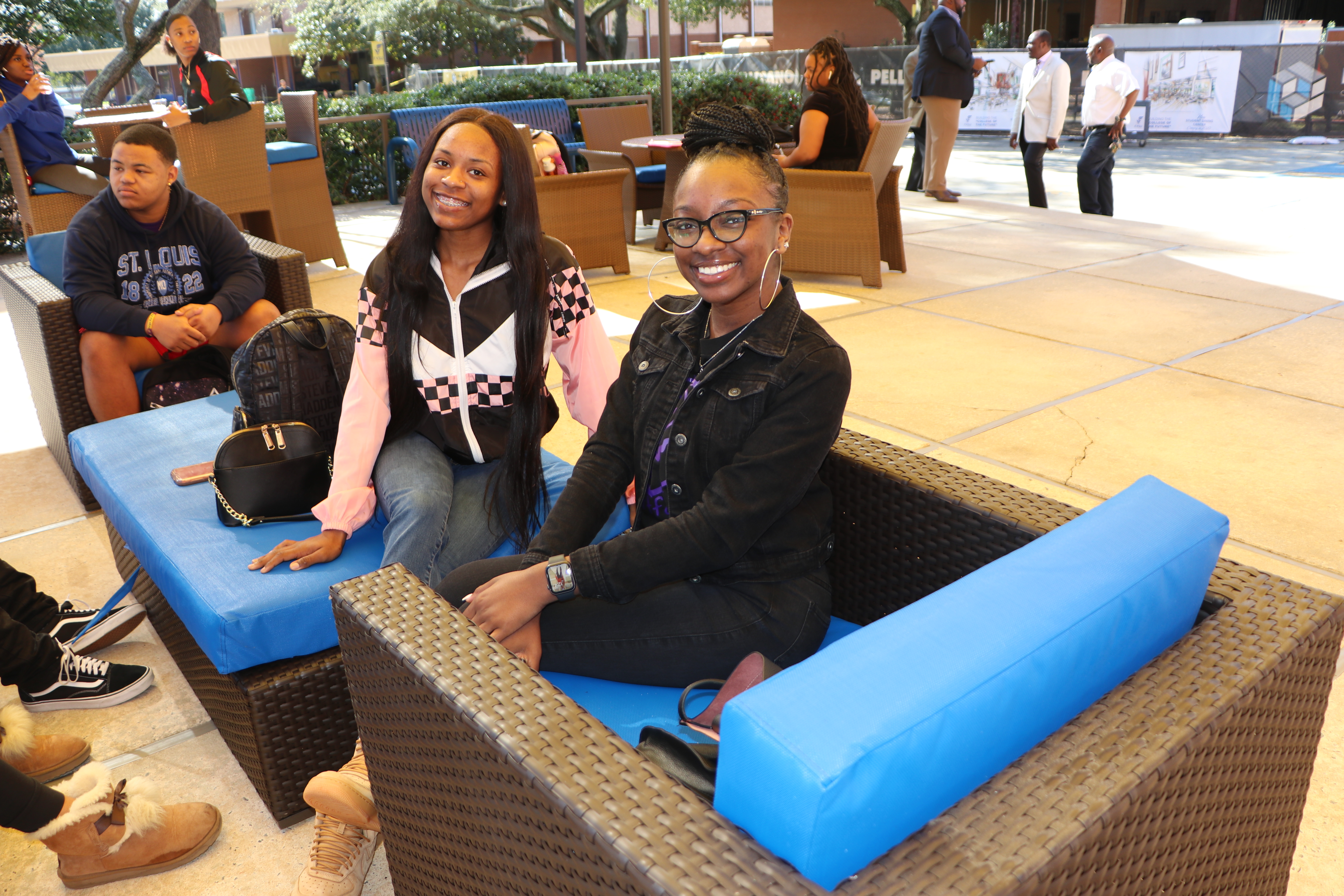 Two students on FVSU campus smiling at camera