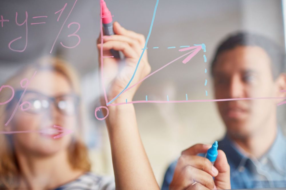 Man and woman working on math problems