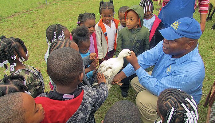 Life on the Farm program Assistant, Chris Sanders, teaches children about animals.