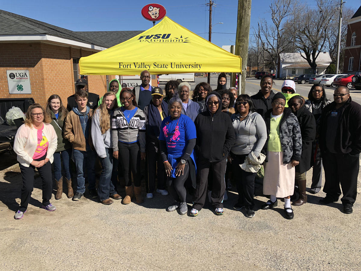 Participants pose for a group photo after taking part in the Twiggs County Jamming Lunch Bunch Walk-A-Thon in Jeffersonville.