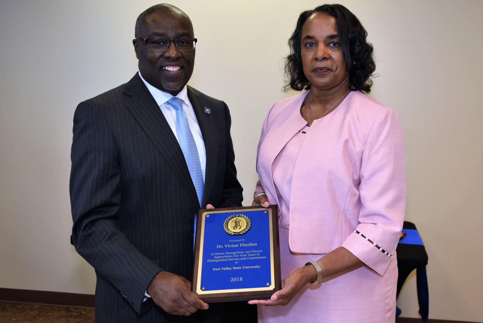 Fort Valley State University President Dr. Paul Jones recognizes Dr. Vivian Fluellen, chair of the Department of Family and Consumer Sciences, during a recent retirement reception at the Agricultural Technology Conference Center.
