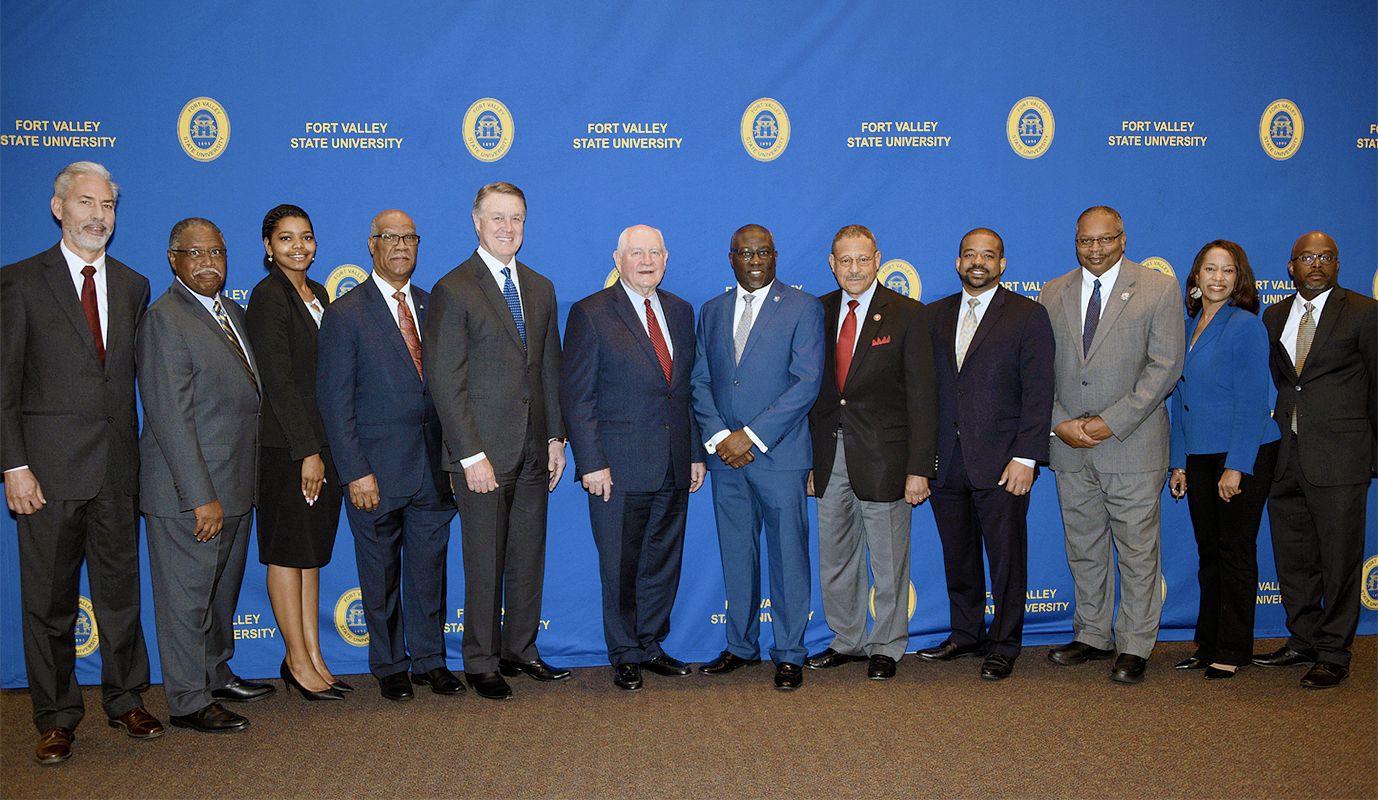 Fort Valley State University faculty and staff pose with elected officials during the 37th annual Ham and Egg Legislative Breakfast.