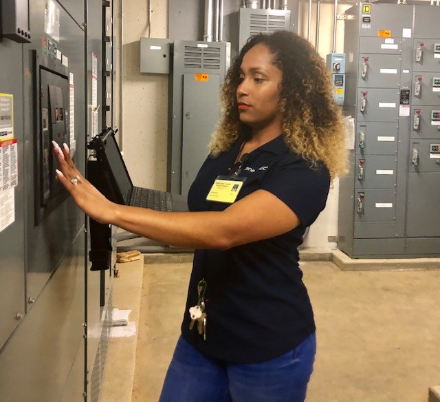 Rolesta Brooks, an FVSU 2017 MPH alumna, programs equipment during an energy audit at a school in Muscogee County, Georgia.
