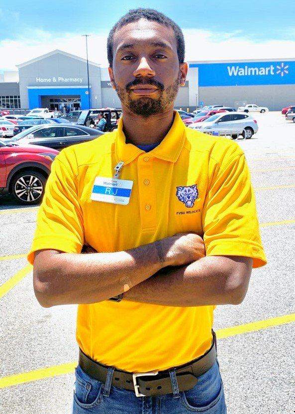 Essential worker Ralph Kelly Jr. serves as a health screener at a central Georgia Walmart to reduce the spread of the coronavirus disease (COVID-19).
