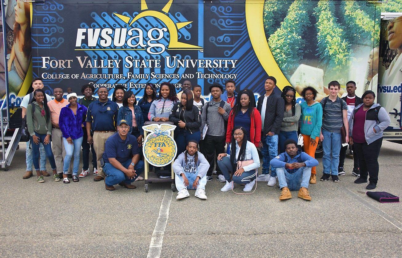 Staff and students from Terrell County High School pose beside Fort Valley State University’s Mobile Information Technology Center (MITC) during Future Farmers of America week in Dawson Feb. 20.