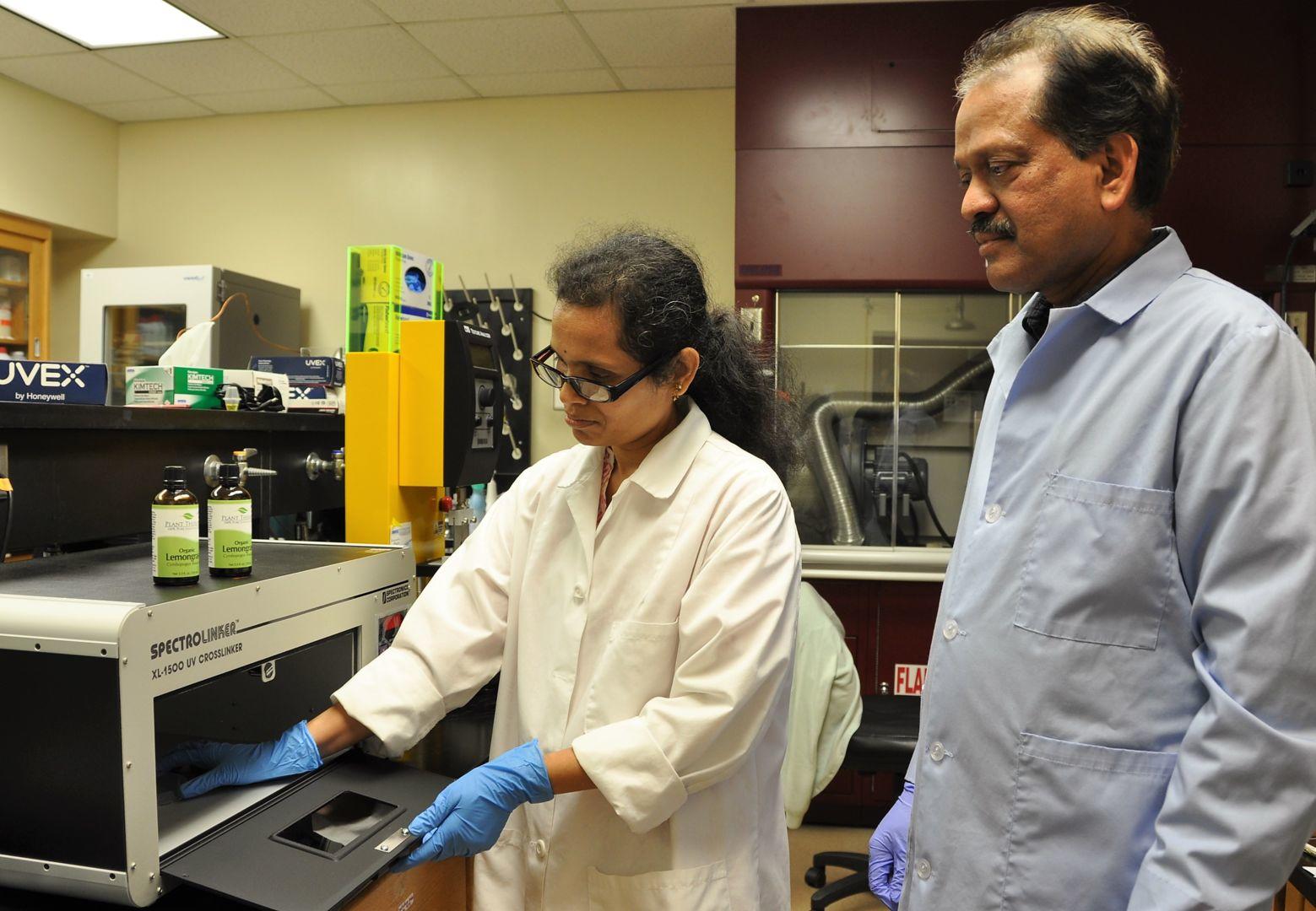 Fort Valley State University researcher Dr. Ajit Mahapatra (right) and his graduate assistant, Hema Degala (left), combine two non-thermal alternatives to kill the Escherichia coli (E. coli) bacteria on goat meat.