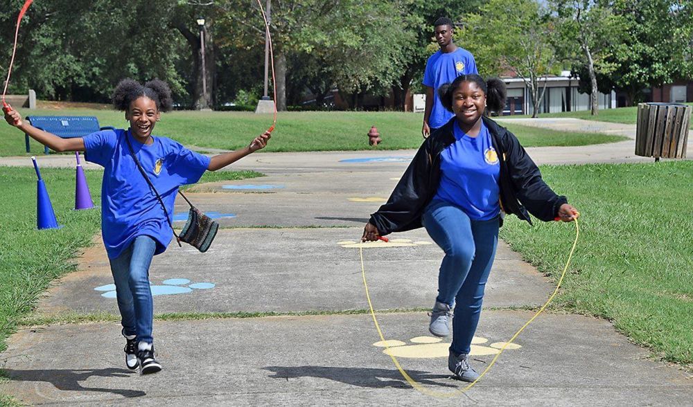 Anala Bond (left) and Tyanna Woodley (right), both seventh-graders from Twiggs County, enjoy a friendly race of jump rope during the 4-H FFA Agriculture Youth Field Day at Fort Valley State University on Sept. 17