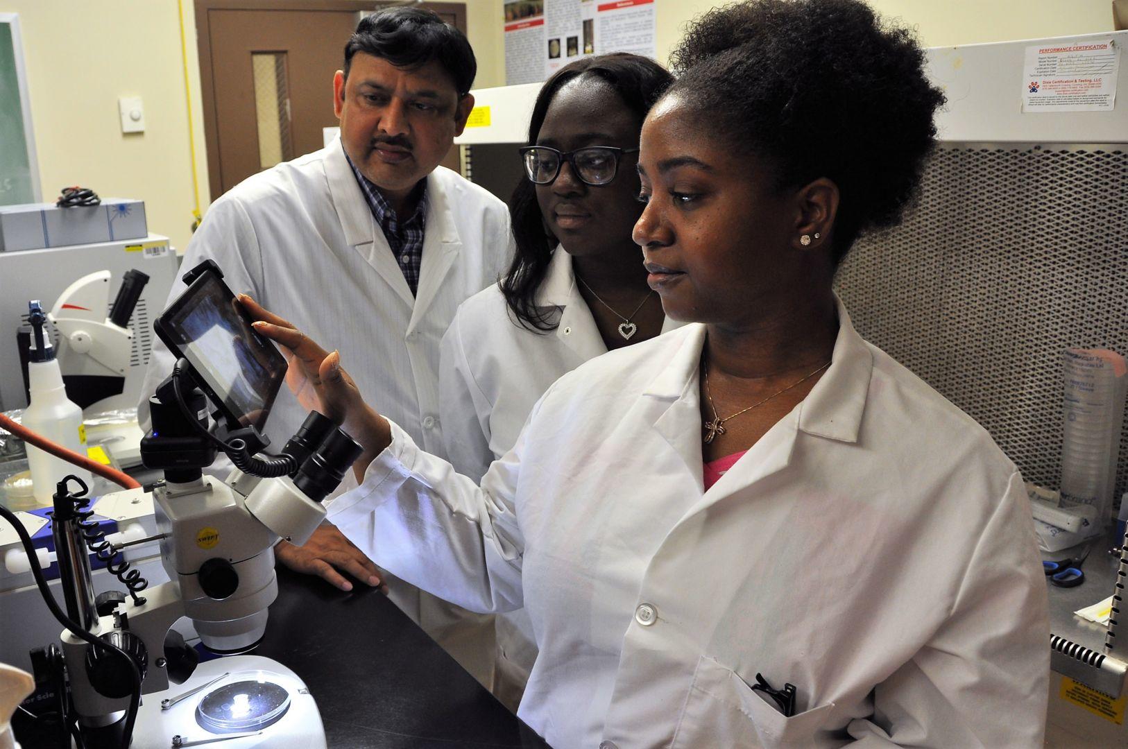 Fort Valley State University researcher Dr. Hari Singh (left) in the nanotechnology laboratory on campus with students Quaneisha Woodford (center) and Jamaura Williams (right).