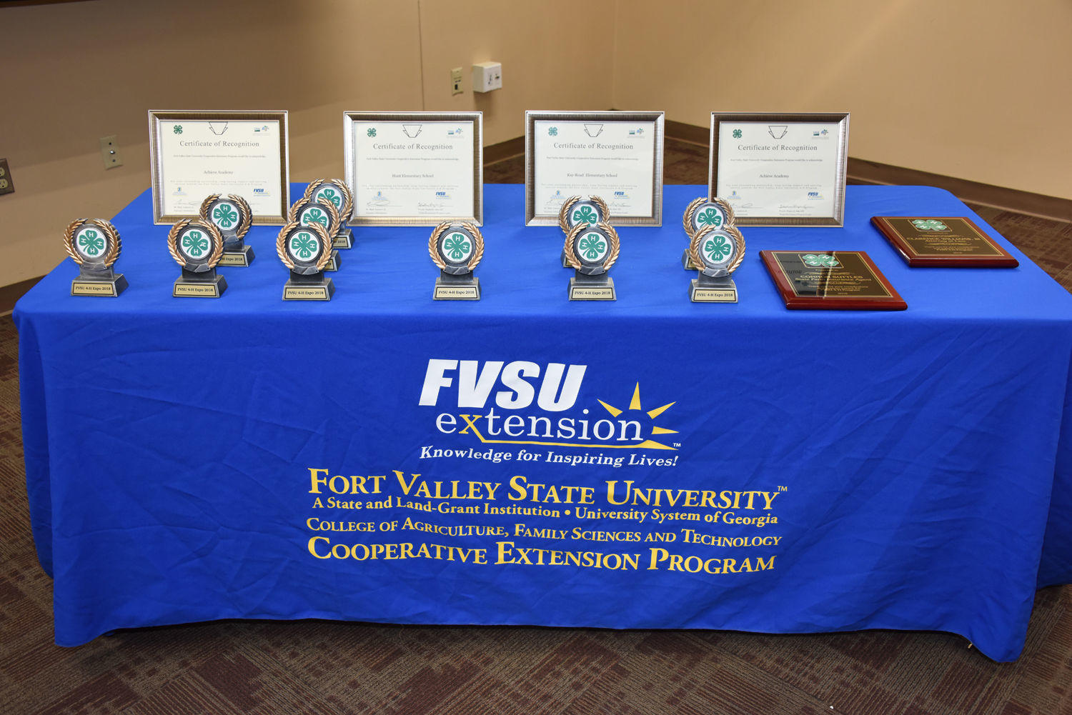 A table full of plaques, trophies and certificates that were given to award recipients during the 4-H Expo closing ceremonies March 22.