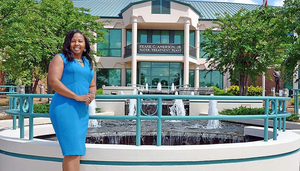 Lisa Golphin stands in front of the Frank C. Amerson, Jr. water treatment plant in Macon, GA.