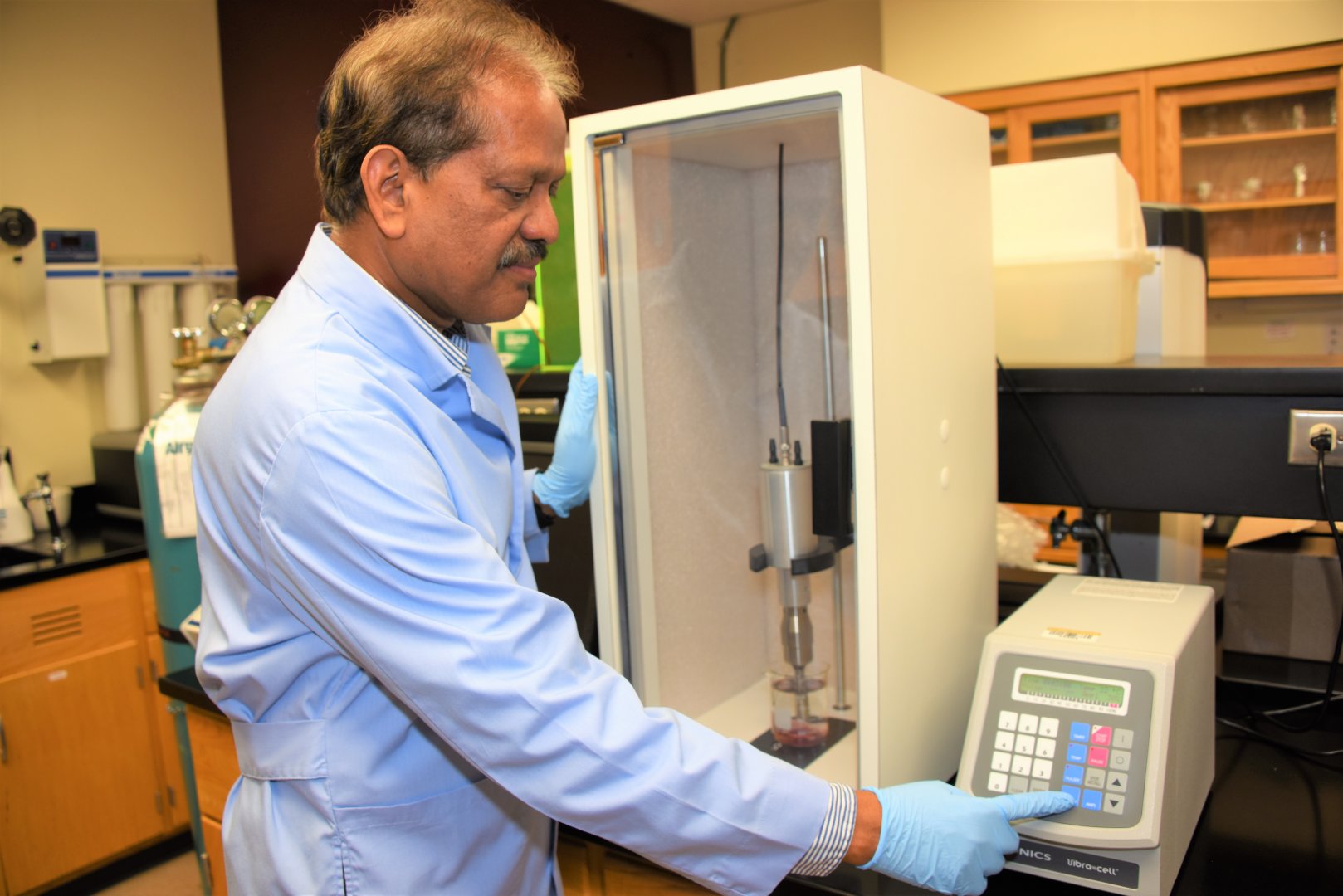 Dr. Ajit Mahapatra, a Fort Valley State University associate professor of food engineering, uses a sonicator to destroy bacteria in goat meat.