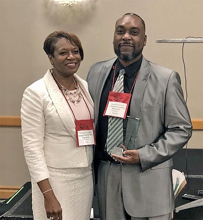 Woodie Hughes Jr. (right), Fort Valley State University’s assistant Extension administrator state 4-H program leader, is presented the Association of Public and Land Grant Universities (APLU) 1890 Award for Excellence in Extension by Dr. Carolyn Williams (left), 1890 Association of Extension Administrators Chair during the Southern Region Program Leadership Network meeting in Orlando on August 20.