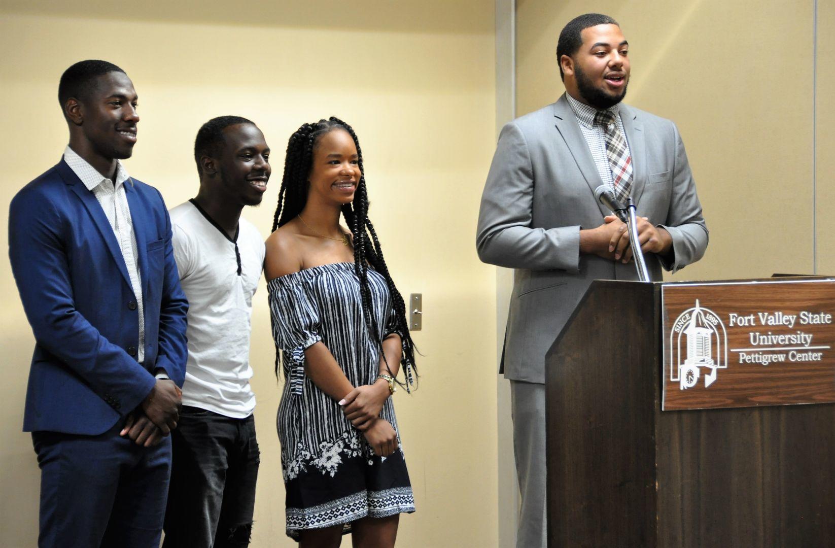 (From left to right) Fort Valley State University students James Taylor, Jontravious Wallace, Ashleigh Porter and Courtney Lester speak about their experience in the Plant Agricultural Biology Graduate Admission Pathways (PABGAP) program during a recent seminar at the Pettigrew Center.