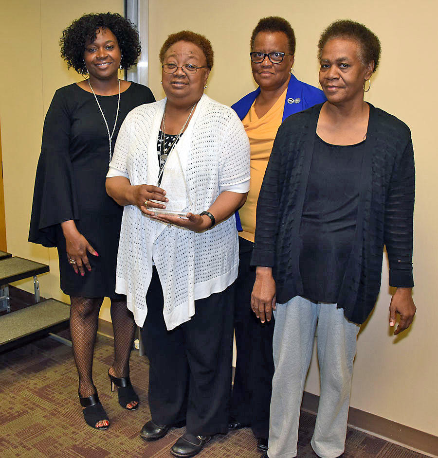 Brenda Maddox (left), Fort Valley State University’s Marion County extension agent, poses with 2017 Family and Consumer Sciences Family of the Year awardee Mary King (center) and members of the King-Taylor family at FVSU’s Pettigrew Center Feb. 21.
