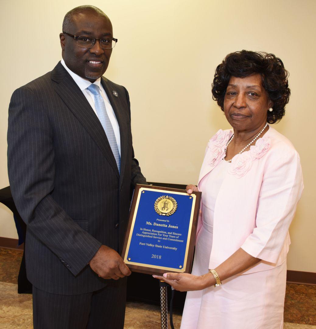 Dr. Paul Jones (left), president of Fort Valley State University, presents Danetta Jones, head of management/fiscal operations for FVSU’s College of Agriculture, Family Sciences and Technology, with a plaque during the 2018 university retirement reception at the Agriculture Technology Conference Center on May 10.