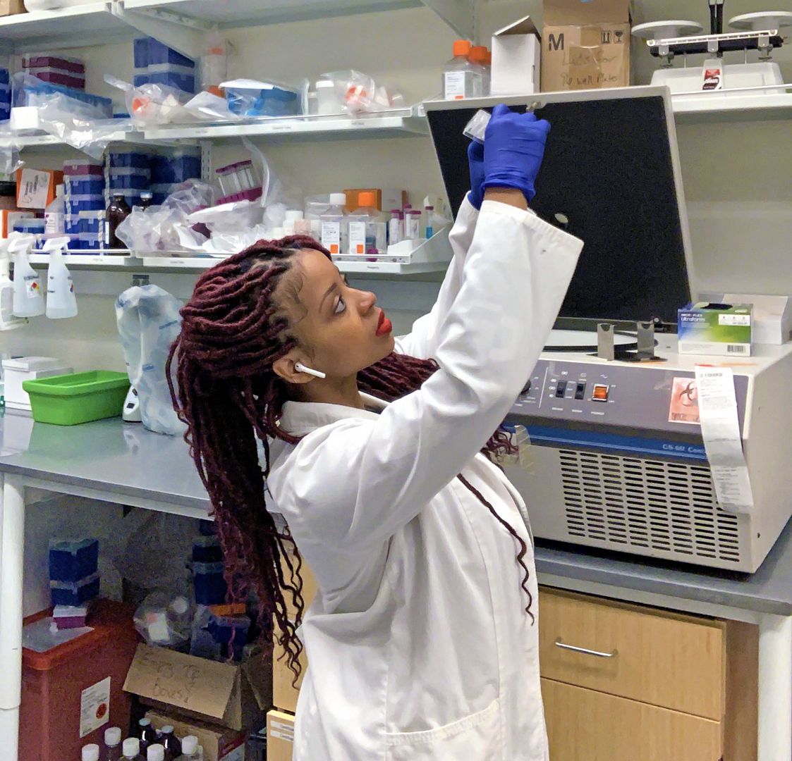 Aisha Hill, a lead research specialist and scientist at Emory University's School of Medicine, conducting research in a lab.