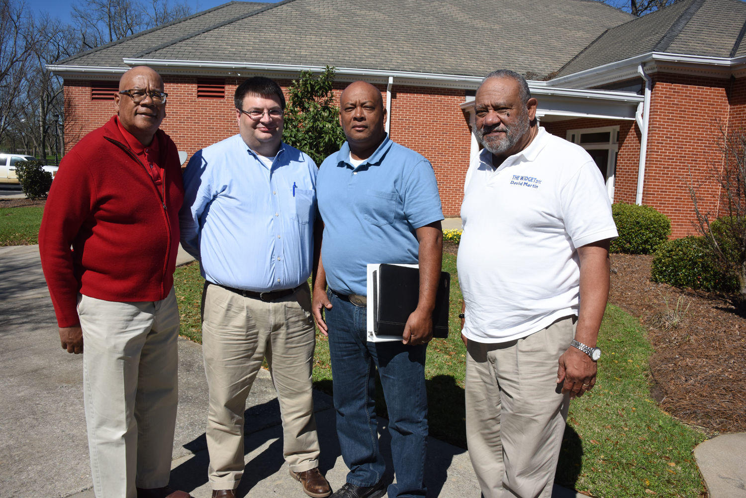 (From Left) Michael Jackson, executive director of Aunt Katie’s Community Garden; Al Burns, business and cooperative specialist for the U.S. Department of Agriculture; Richard Miller, part time farmer and David Martin, CEO of Widget Development and Training pause for a break during the Professional Development Workshop March 2.