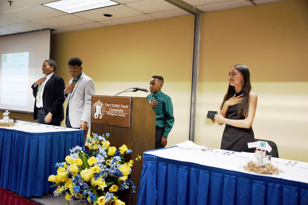Students lead banquet attendees in reciting the 4-H pledge during closing ceremonies of the inaugural Fort Valley State University 4-H Expo at the C. W. Pettigrew Center on March 22.