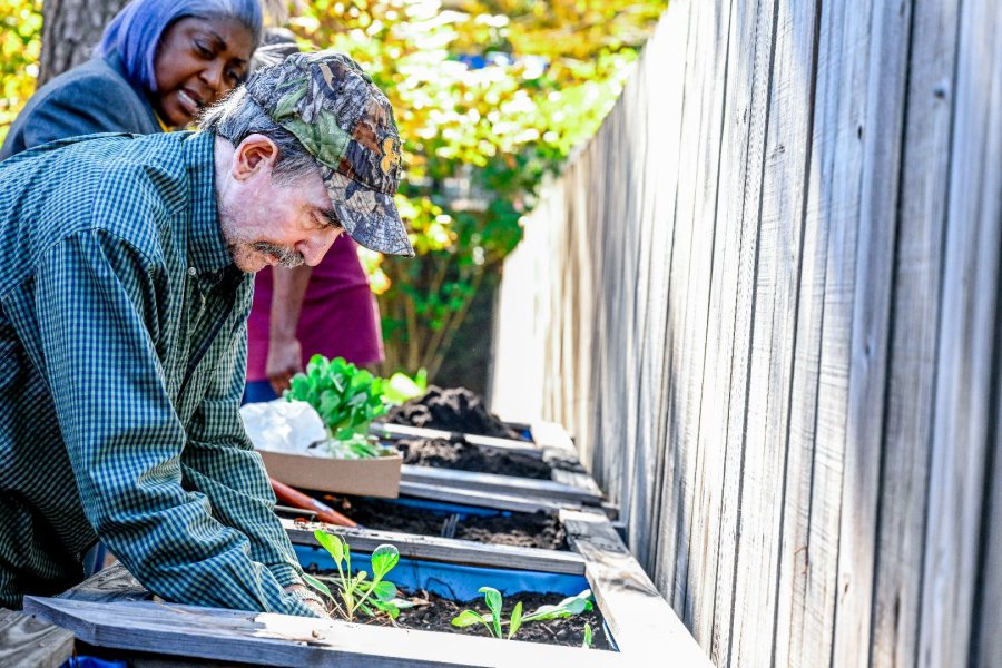 A Twiggs County resident helps refresh the raised beds at a local community center.