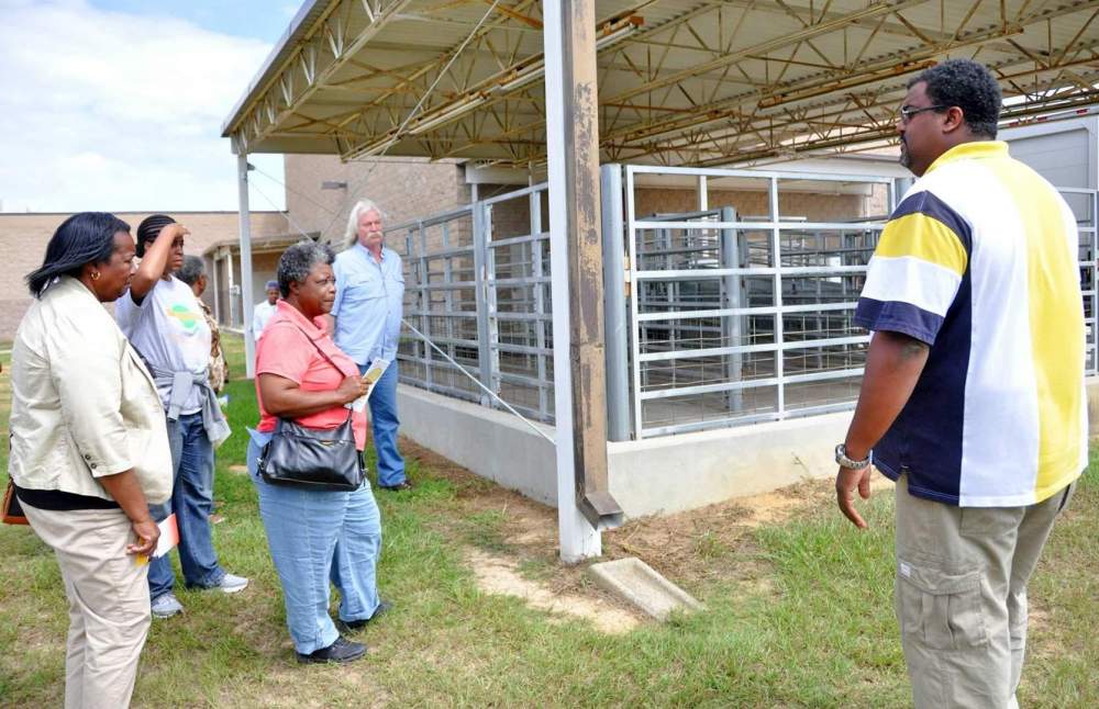Terrell Hollis, manager of Fort Valley State University’s meat processing facility, provides a tour for Florida ranchers and farmers.