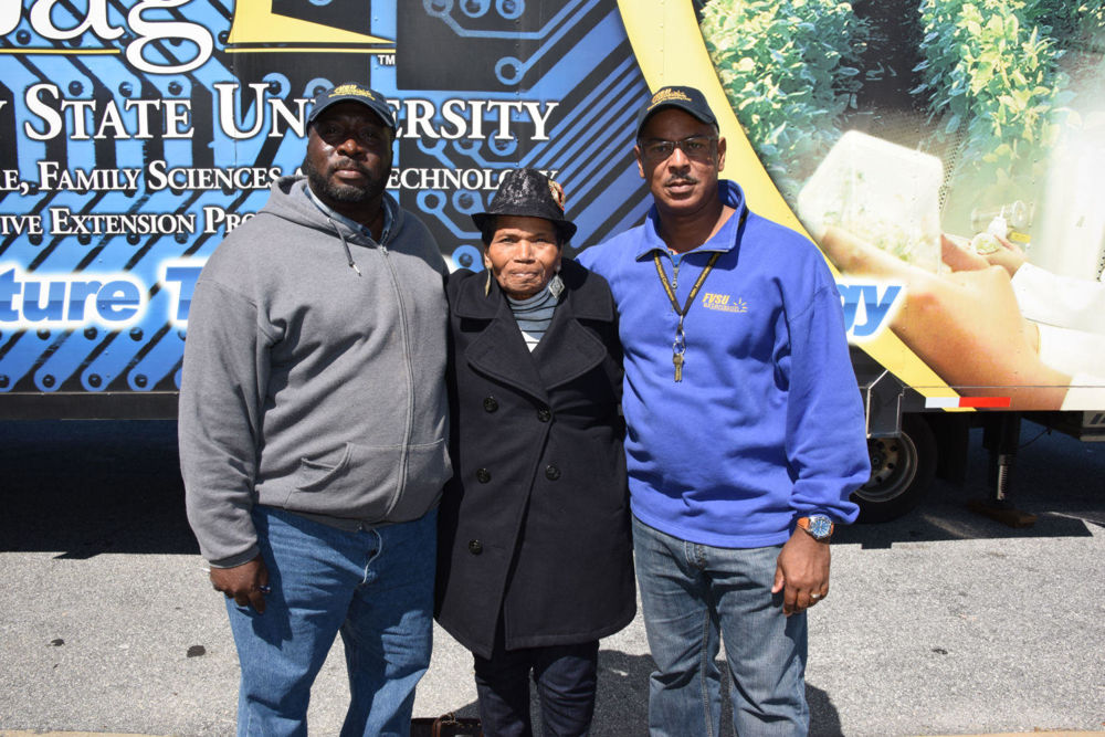Stephan Price (left), Fort Valley State University Bulloch County Extension agent and Charlie Grace (right), FVSU Dougherty County Extension agent, pose with local farmer Ruby Davis during a break at the Simplified Recordkeeping Training Class in Albany March 13.