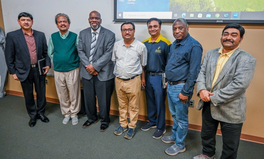 Dr. Patil stands with Dr. Keith Howard, dean of the College of Agriculture, Family Sciences and Technology; Dr. Brou Kouakou, associate dean for research; and research faculty.