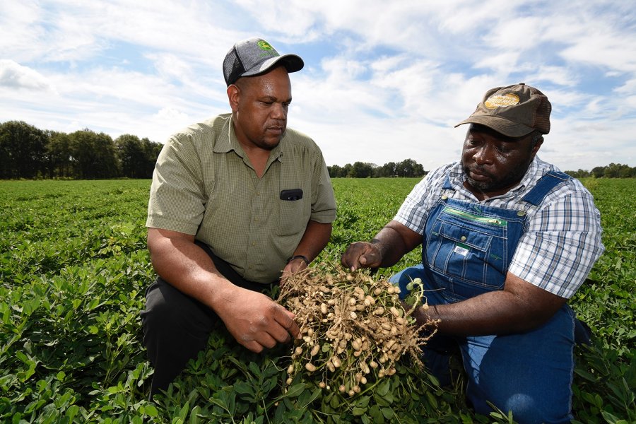 Tony Scott (left) receives technical assistance from Stefan Price (right), FVSU County Extension agent, to help him manage hundreds of acres of crops.