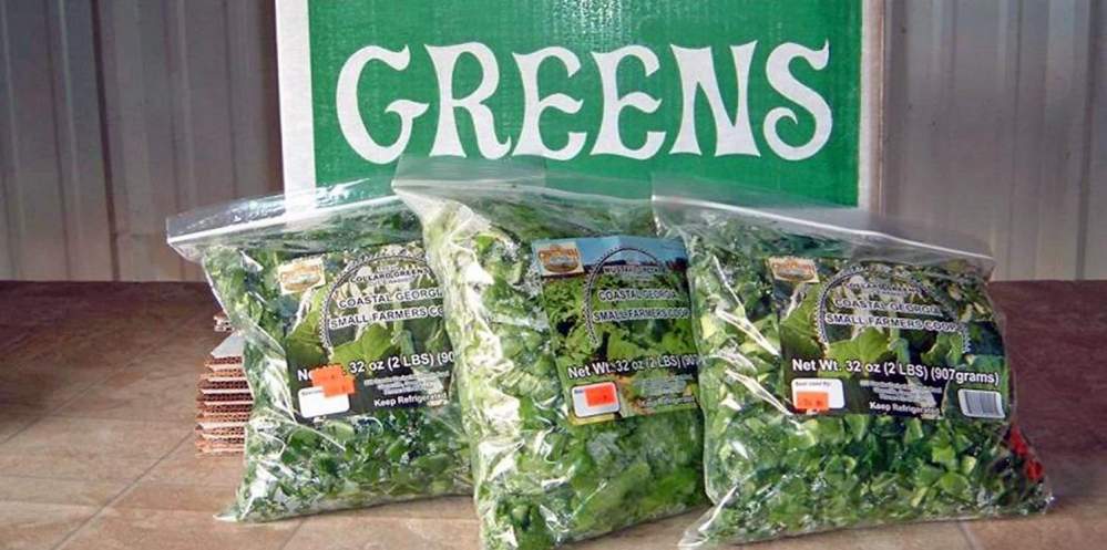 Bags of greens grown by the Coastal Georgia Small Farmers Co-op based in Glenville.