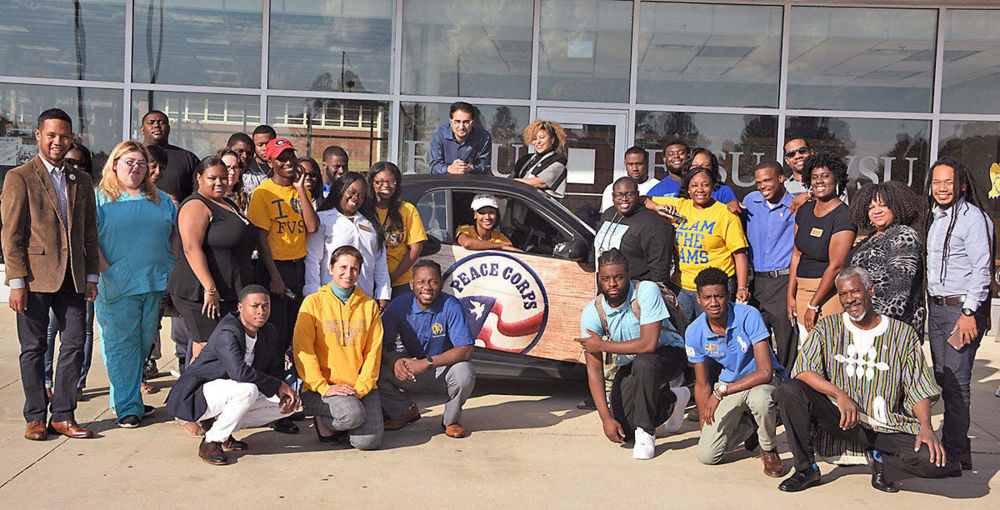 Fort Valley State University staff and students pose with Peace Corps representatives and their Peace Corps car at FVSU’s Student Amenities Building on Nov. 4.