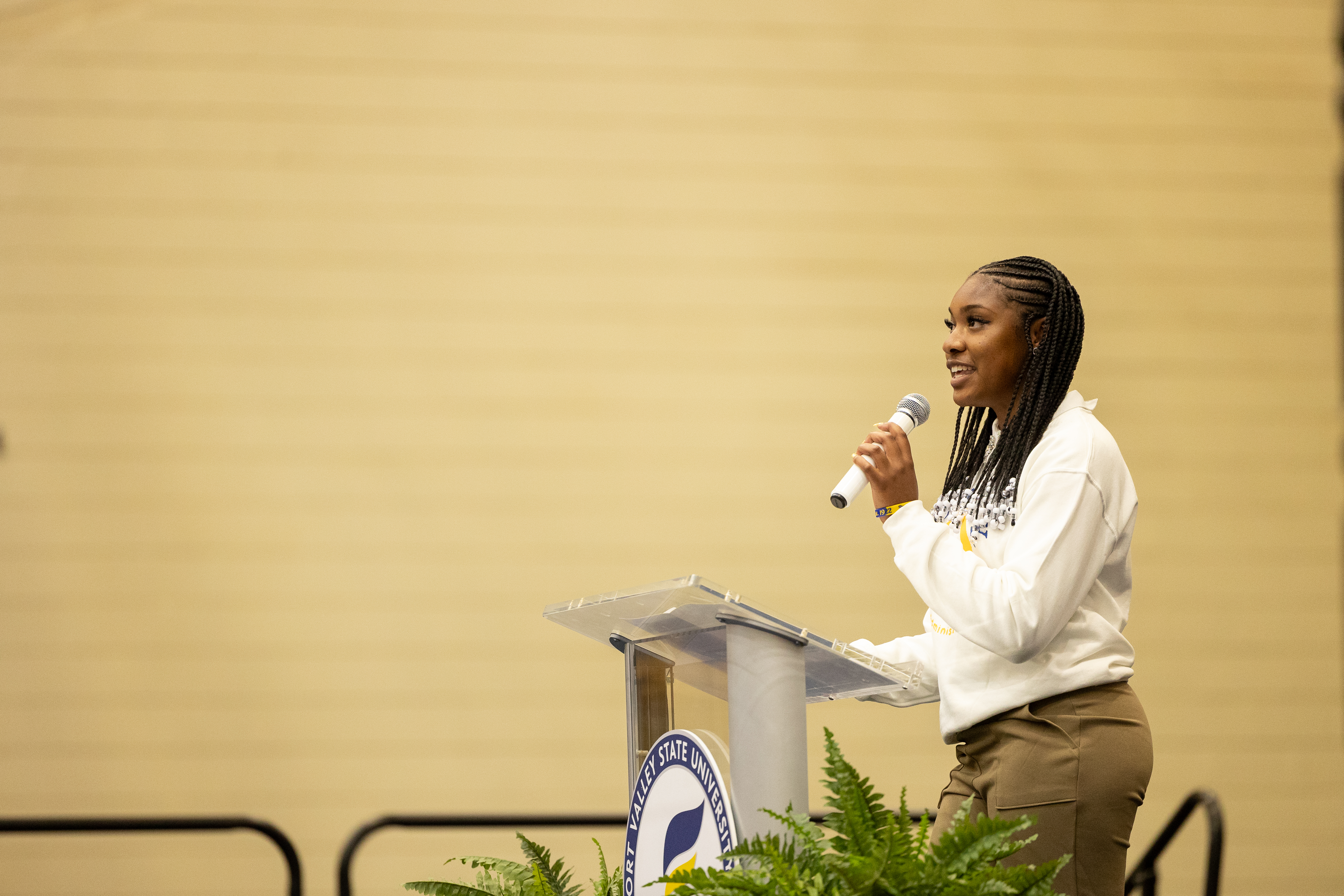political science student speaking at a podium