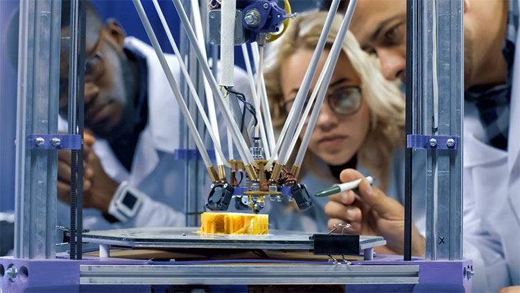 Students studying laser with instructor