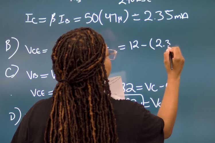 Young lady solving math equation