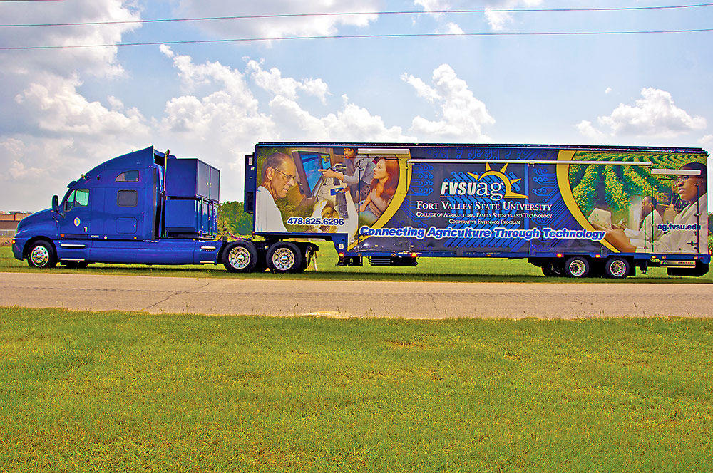 Left side view of Mobile Information Technology Center truck.